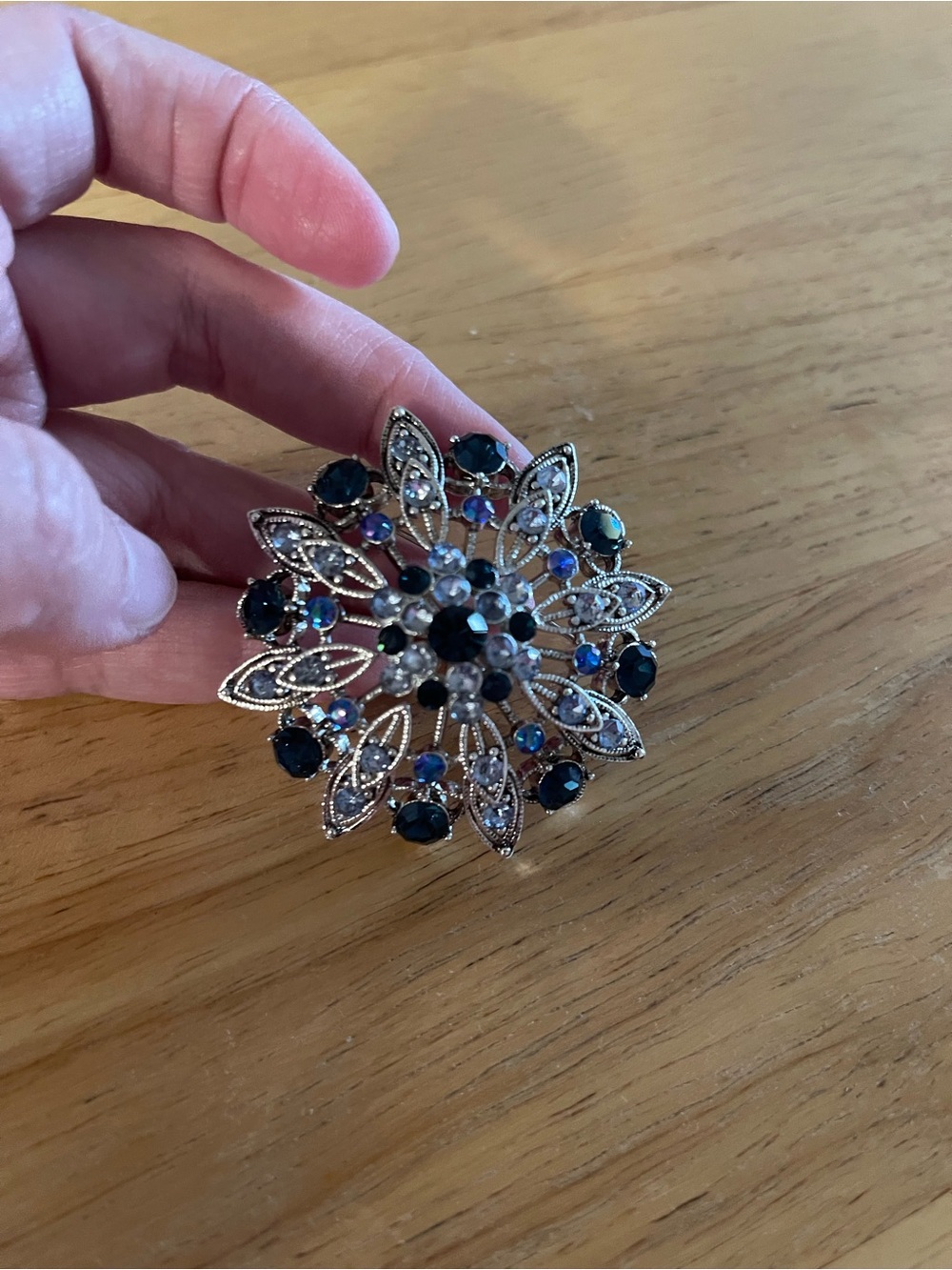 Silver Floral Brooch with Dark Blue and Iridescent Stones